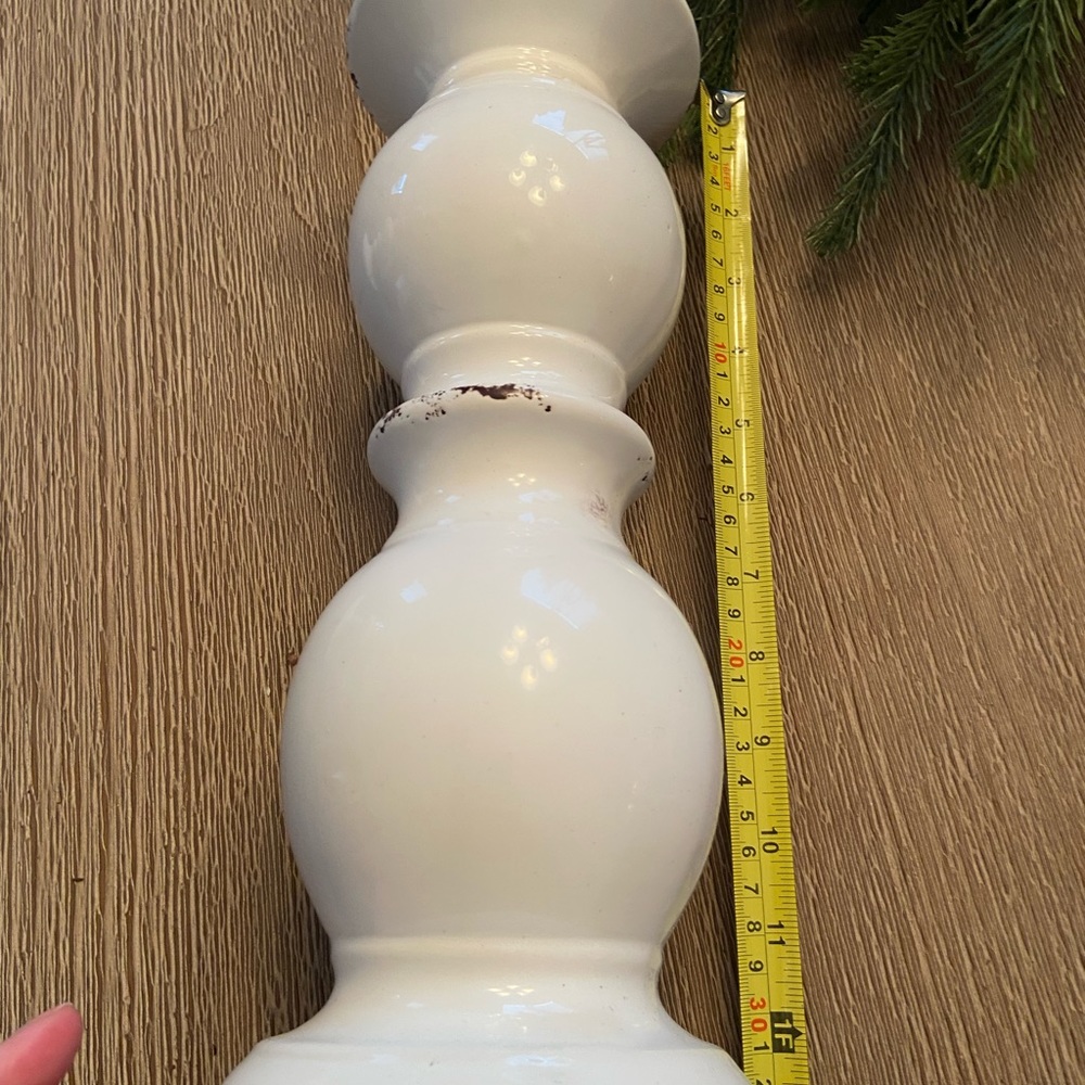 White ceramic candle holder meant to look distressed with brown edging